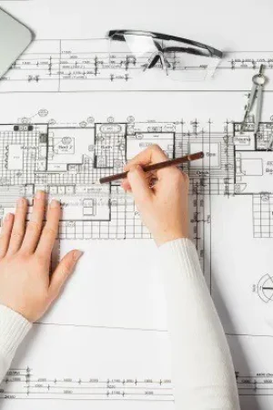 hands-of-drawing-architect_23-2147710937